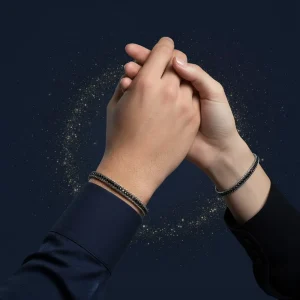 Amorino Tennisunisex bracelet with thick Grumet chain, 316L Stainless Steel, adorned with Zirconia crystals and rhodium plating. Ideal gift in Cyprus. man and woman holding hands wearing the bracelet