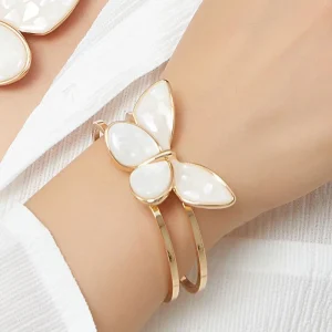 On Hand Belle Miss ALBINENN rigid bracelet with golden structure and large white butterfly motif made of resin. Jewelry gift Cyprus
