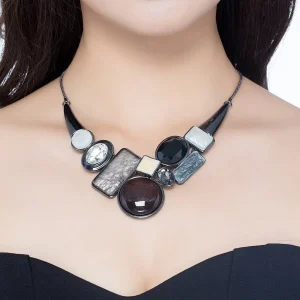 Woman wearing Belle Miss CHLEO necklace with large motif, black enamel, and crystal. Thick chain, jewelry gift Cyprus.