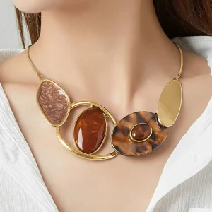 Woman wears Belle Miss EIRENE necklace with large motif, brown enameled elements and resin. Stainless steel chain, jewelry gift Cyprus.