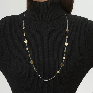 Woman wears Belle Miss ULLASTINA necklace, fine gold stainless steel long chain (sautoir) with a delicate heart motif. Jewelry gift Cyprus