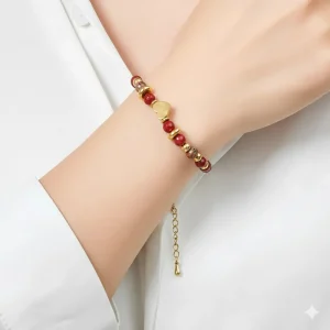 woman wears Belle Miss VITALIE bracelet, gold-plated stainless steel chain with natural red tinted stones and small heart motifs. Jewelry gift Cyprus