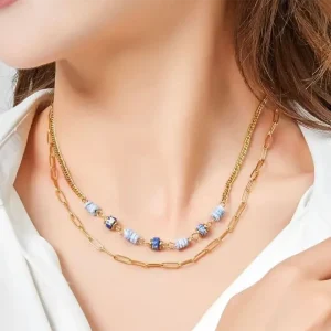 Woman wearing Vana double-row necklace with mother-of-pearl. Jewelry gift Cyprus.