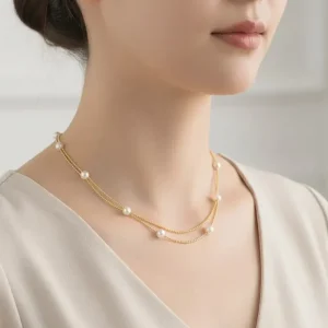 Woman wears a necklace with pearls, Stainless Steel, and Gold Tone finish. Ideal gift in Cyprus.