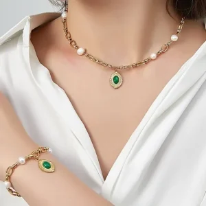 Woman Wears Usagi Gold-plated Steel Chain Bracelet with Freshwater Pearls & Green Natural Stone Pendant